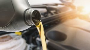 close-up-of-oil-pouring-in-car-royalty-free-image-1054347190-1540912843-min